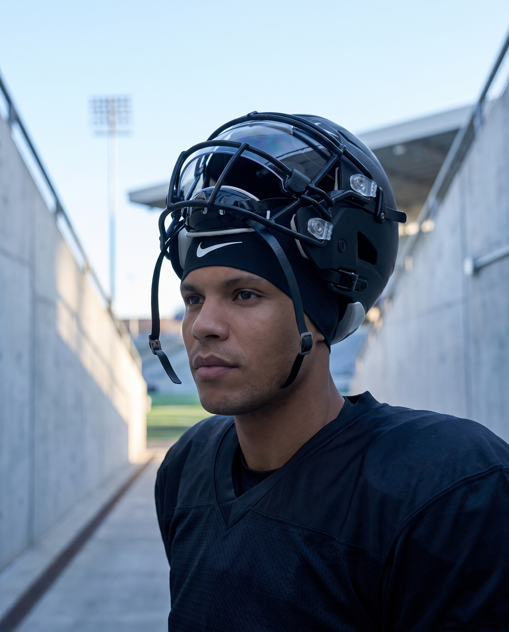 Nike Dri-FIT Skull Cap in black worn under a football helmet